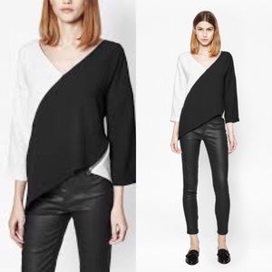 Black and white asymmetrical  top...3/4 sleeve...